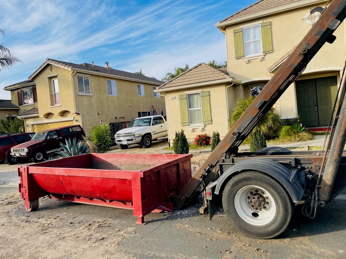 Well-organized dumpster loading at residential property